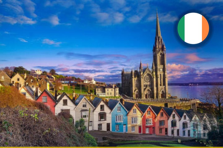 Harbour houses and St Colman's Cathedral in Cobh, County Cork — overseas jobs in Ireland